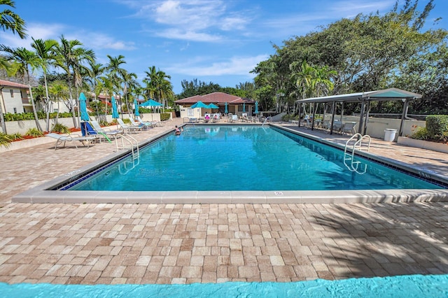 view of swimming pool featuring a gazebo and a patio area