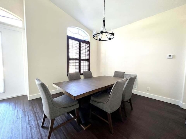 dining room featuring a chandelier and dark hardwood / wood-style floors