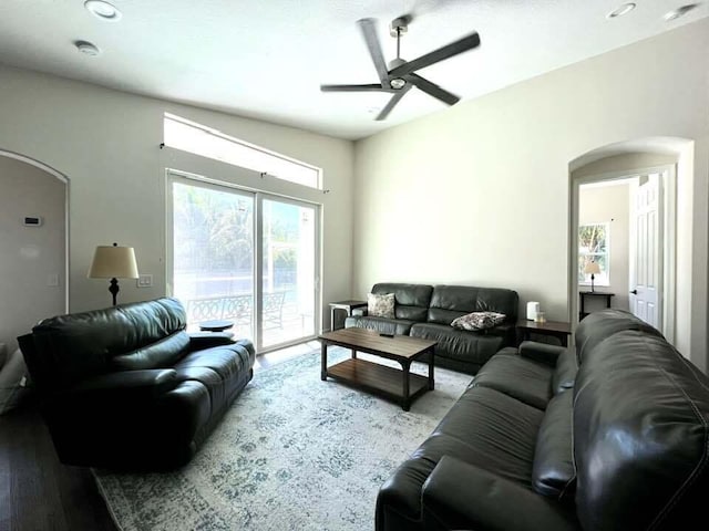 living room with hardwood / wood-style flooring, ceiling fan, and a healthy amount of sunlight