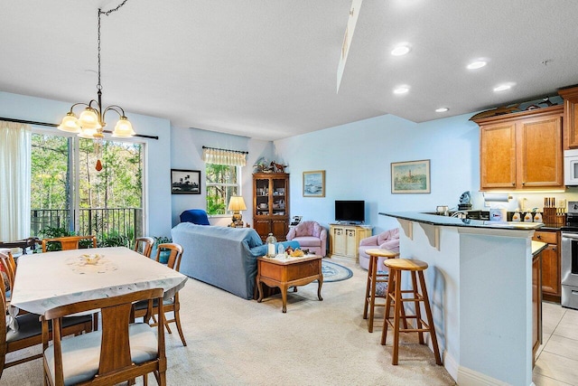 interior space with plenty of natural light, light colored carpet, a textured ceiling, and a chandelier