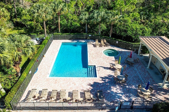 view of pool featuring a community hot tub