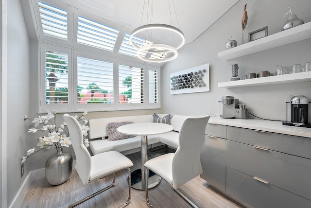 dining room with breakfast area and light hardwood / wood-style floors