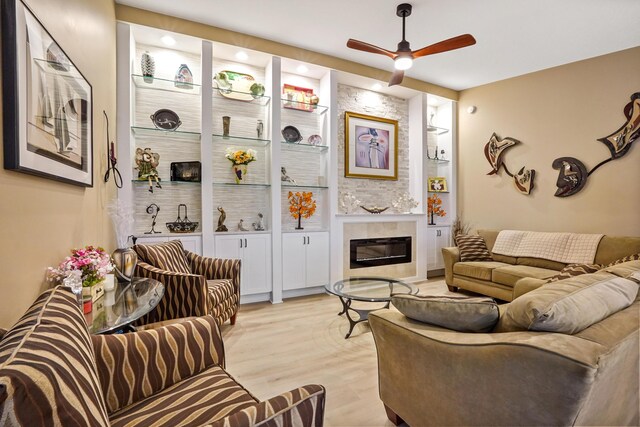 kitchen featuring sink, a kitchen breakfast bar, kitchen peninsula, white cabinets, and appliances with stainless steel finishes