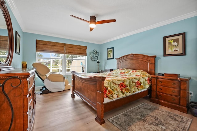 bedroom with ceiling fan, light wood-type flooring, and ornamental molding