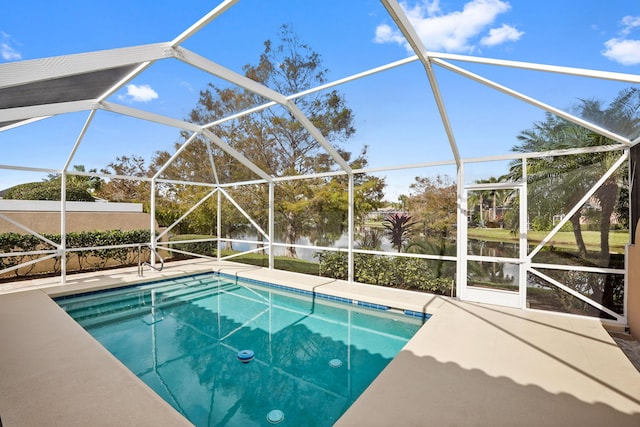 pool featuring a lanai and a patio area