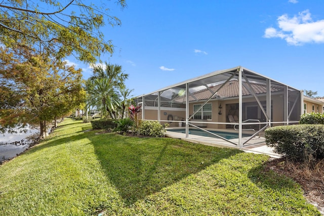 view of yard with glass enclosure