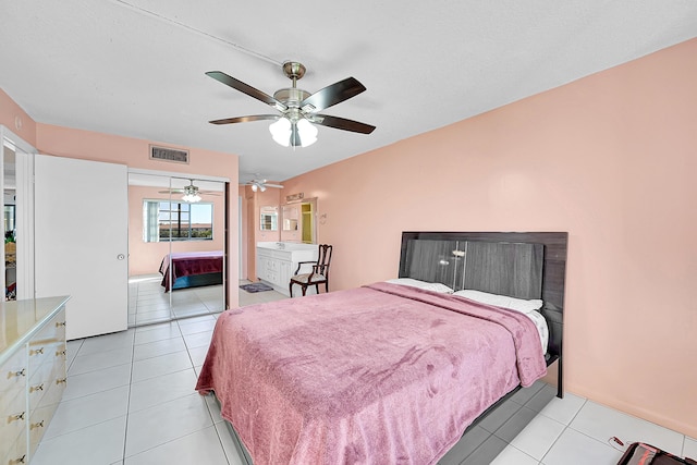 bedroom featuring light tile patterned floors and ceiling fan