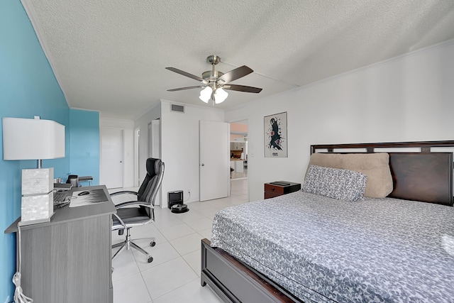 tiled bedroom featuring ceiling fan, crown molding, and a textured ceiling