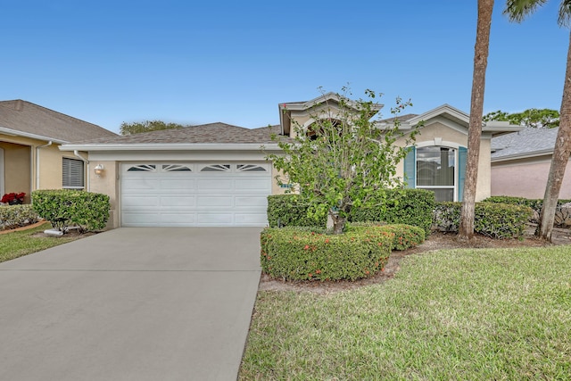 view of front of house featuring a garage and a front yard