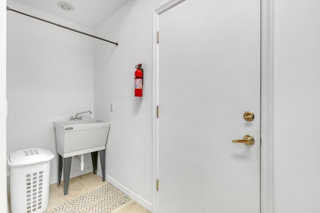 bathroom with tile patterned floors