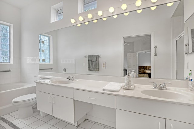 full bathroom featuring tile patterned floors, vanity, independent shower and bath, and toilet