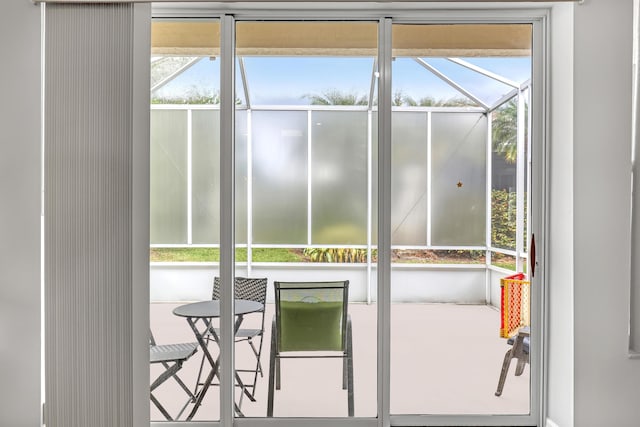 doorway to outside featuring a sunroom