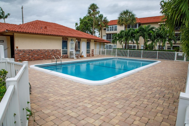 view of swimming pool featuring a patio