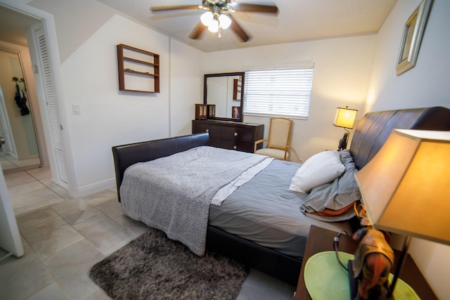 tiled bedroom with ceiling fan