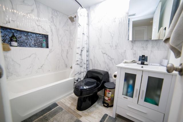 full bathroom featuring shower / bath combo, tile walls, vanity, wood-type flooring, and toilet