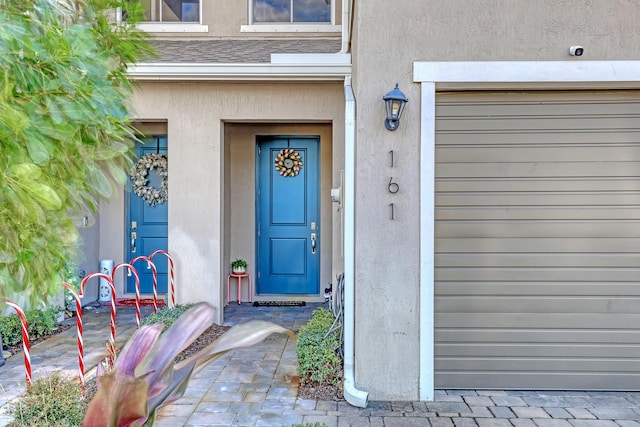 property entrance with a garage