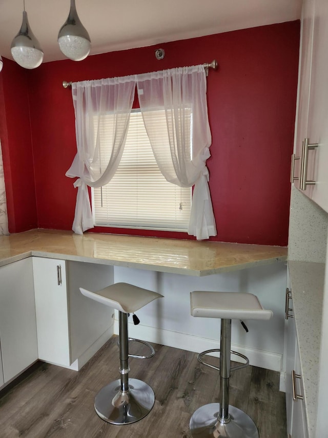 dining space featuring wood-type flooring