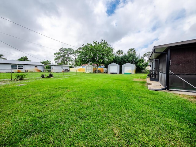 view of yard with a storage unit