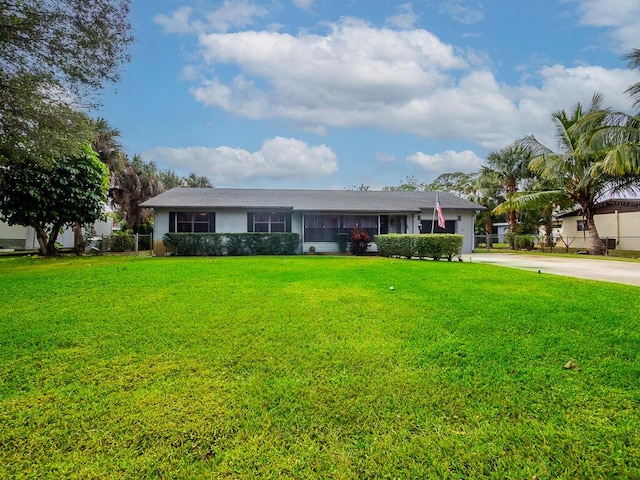 ranch-style house with a front yard