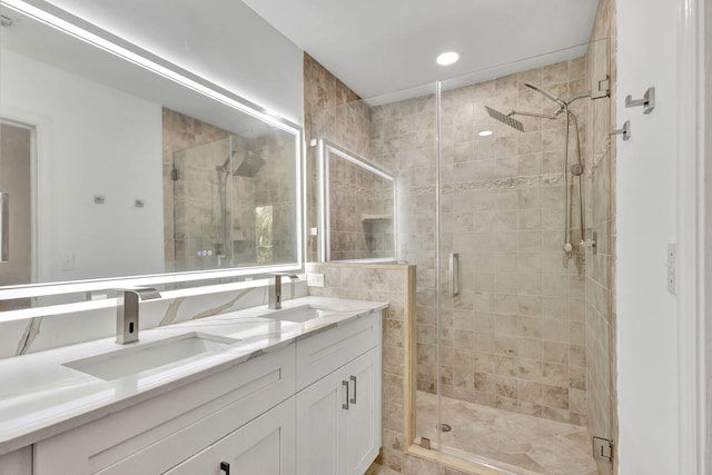 bathroom with vanity and walk in shower