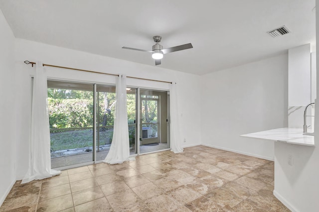 spare room featuring ceiling fan