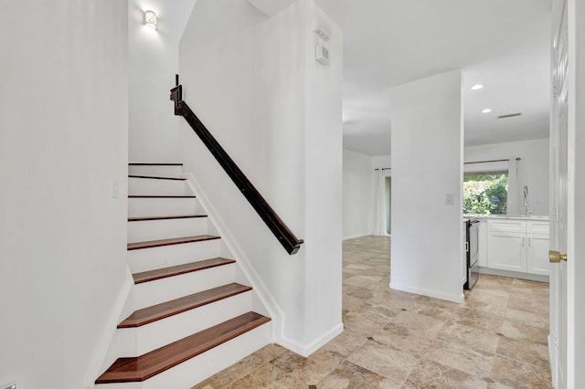 stairs featuring sink