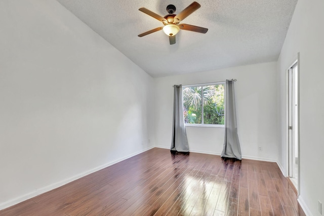 spare room featuring ceiling fan, dark hardwood / wood-style flooring, and a textured ceiling