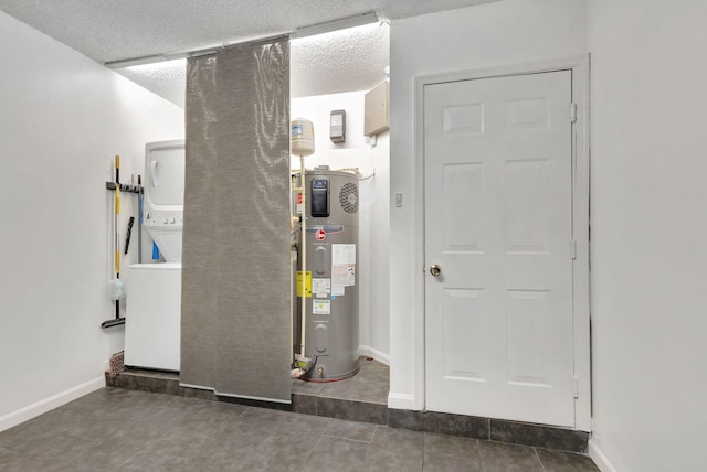 utilities featuring stacked washer / dryer and hybrid water heater