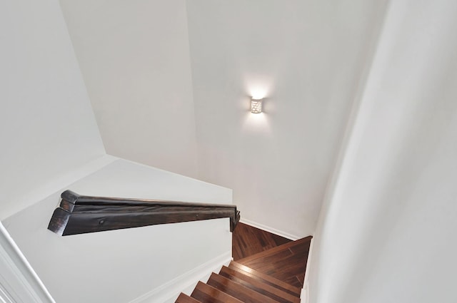 stairway featuring wood-type flooring