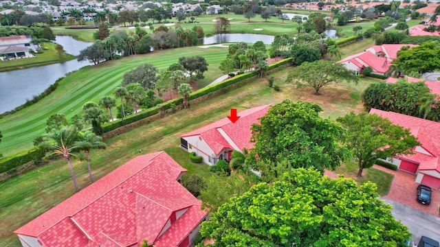 aerial view featuring view of golf course and a water view