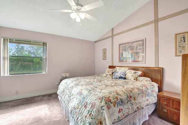 carpeted bedroom with ceiling fan and lofted ceiling