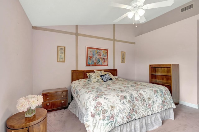 bedroom featuring ceiling fan, light carpet, and lofted ceiling