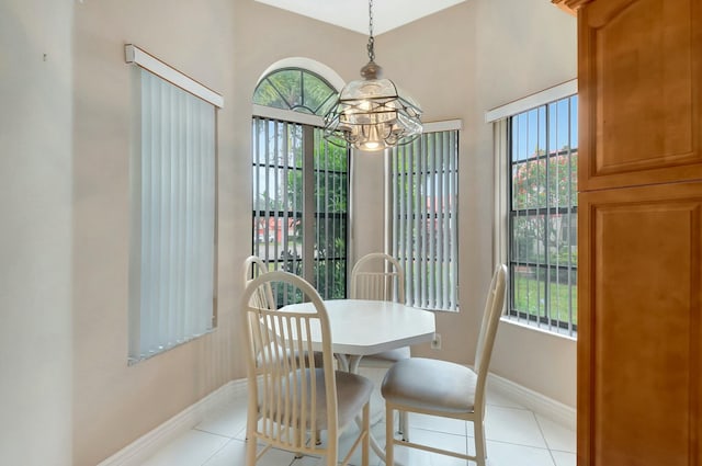 7676 Lexington Club Blvd Unit A, Delray Beach, FL 33446 - dining space with a chandelier, healthy amount of natural light, and light tile patterned flooring