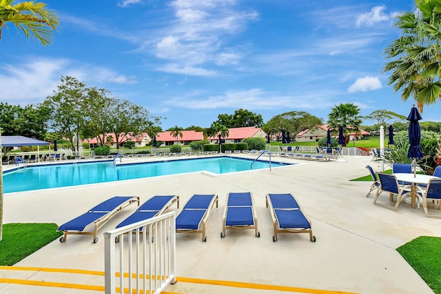 7676 Lexington Club Blvd Unit A, Delray Beach, FL 33446 - community pool with a patio