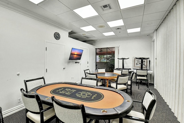 dining space featuring a drop ceiling