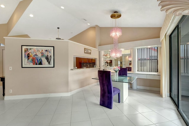 dining space featuring vaulted ceiling, light tile patterned flooring, and ceiling fan with notable chandelier