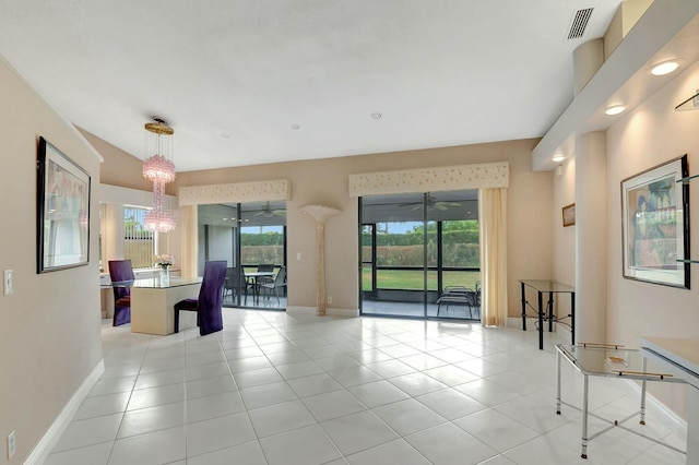 7676 Lexington Club Blvd Unit A, Delray Beach, FL 33446 - unfurnished room with light tile patterned floors, baseboards, and a chandelier