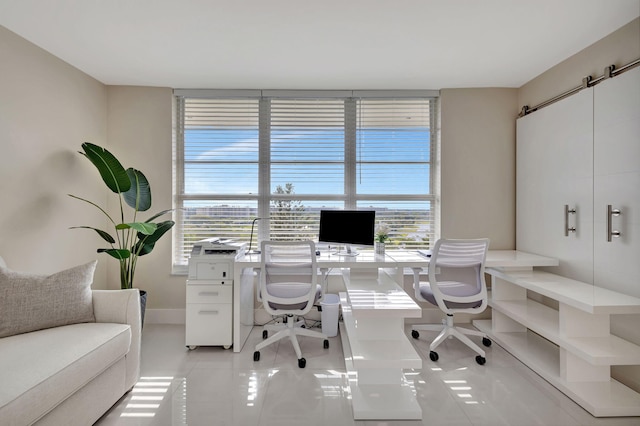 office space with plenty of natural light and light tile patterned floors