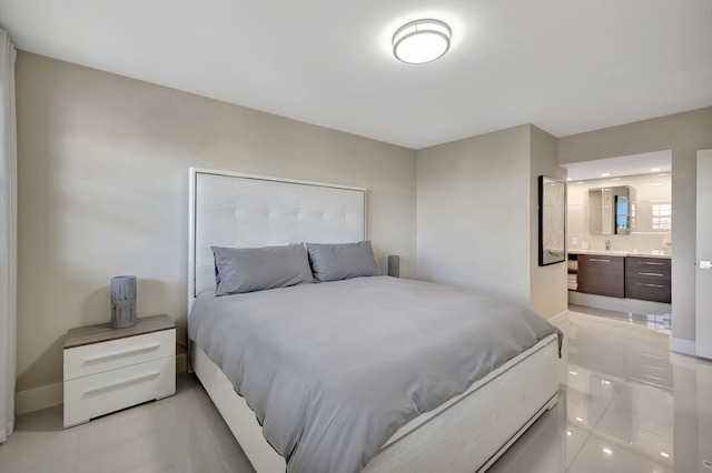 tiled bedroom featuring ensuite bathroom