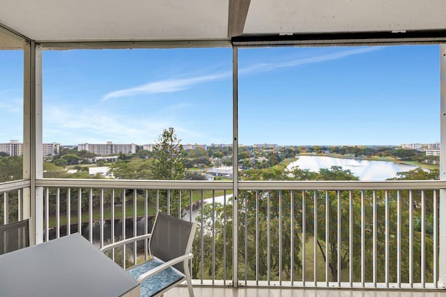 balcony featuring a water view