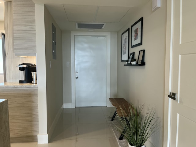 entryway featuring light tile patterned floors and electric panel