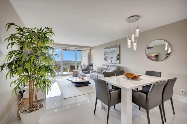 tiled dining space with floor to ceiling windows