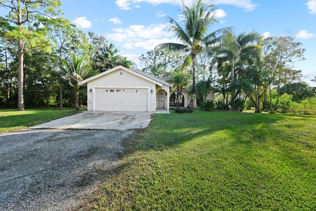 view of front facade featuring a front yard and a garage