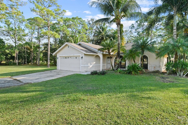 view of front of property with a front yard and a garage