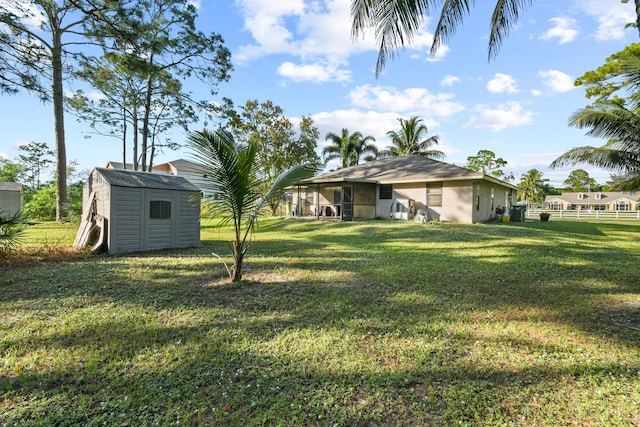 view of yard featuring a storage unit