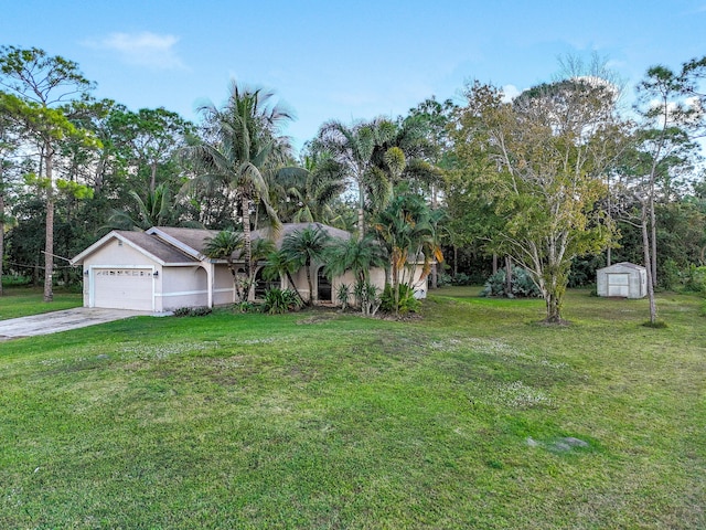 view of front of property with a storage unit, a garage, and a front lawn