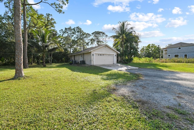 exterior space with a lawn and a garage