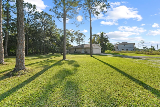 view of yard featuring a garage