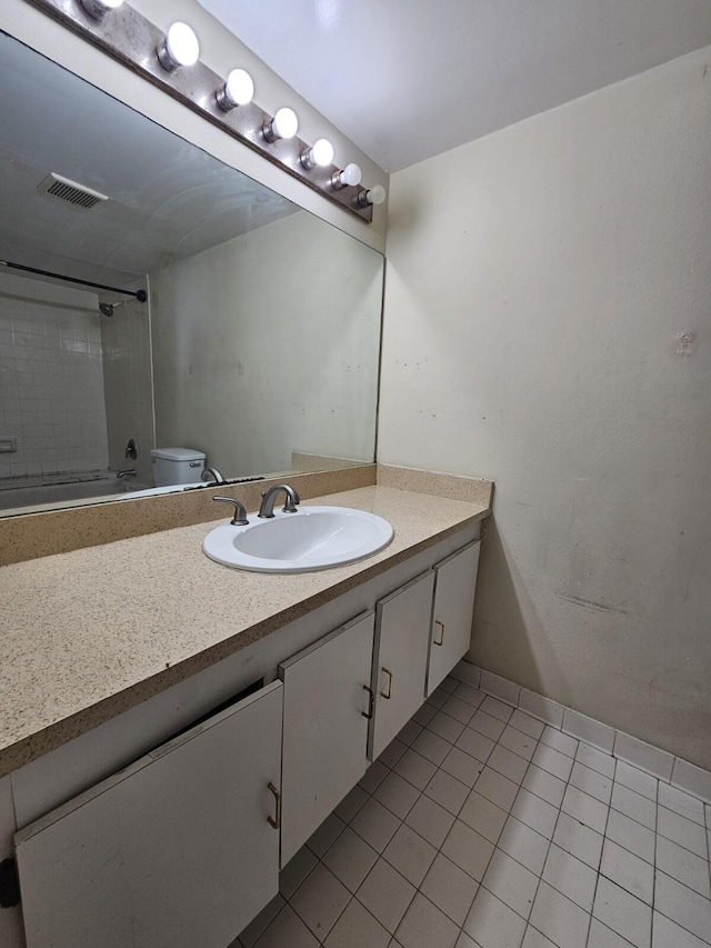 full bathroom featuring visible vents, toilet, enclosed tub / shower combo, tile patterned floors, and vanity