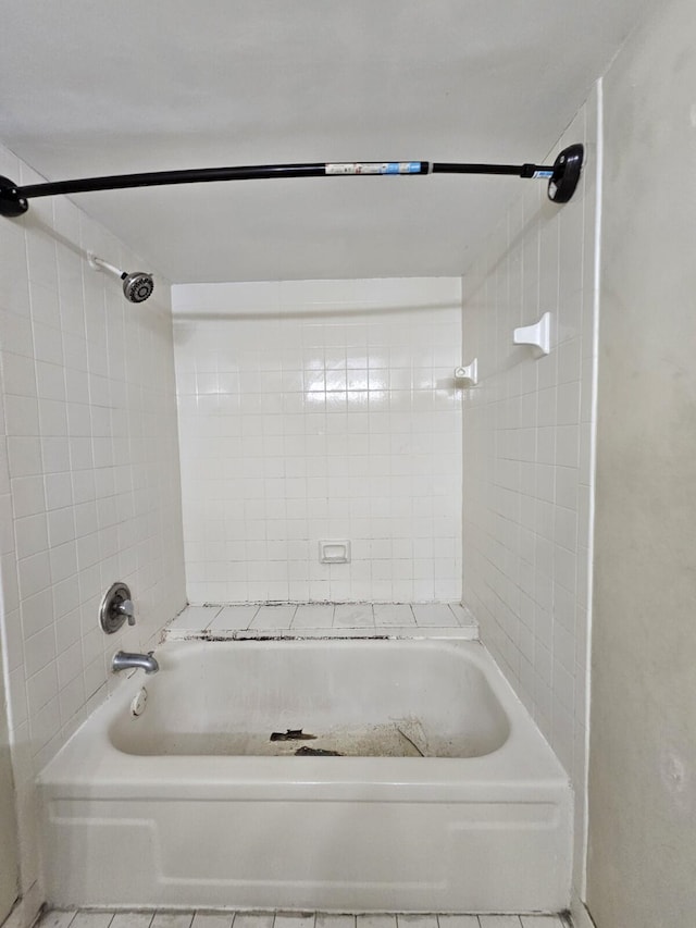 bathroom with shower / washtub combination and tile patterned flooring